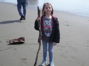 Sophia and her stick. She drew all over the sand.