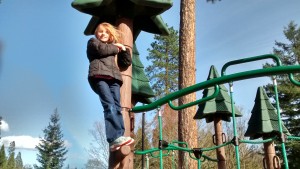 Sophia doing what she does best, climbing.